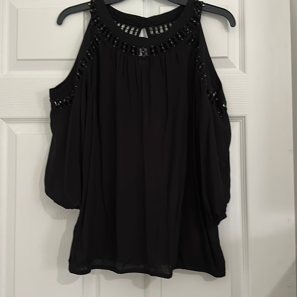 INC cold shoulder top with cute cutouts around neck and shoulders.